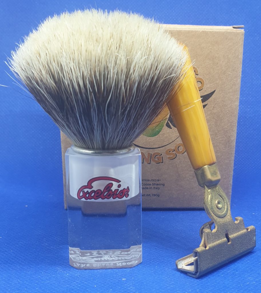 A Flying Mango box, mostly obscured by a TSN LE 2012 brush and a Schick E2 Injector from 1941.