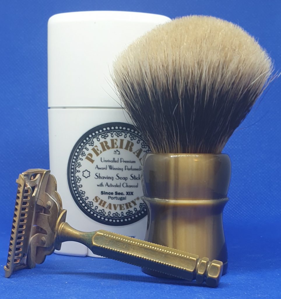 Front to back: GEM 1912 single edge razor, badger shaving brush, stick of Pereira shaving soap